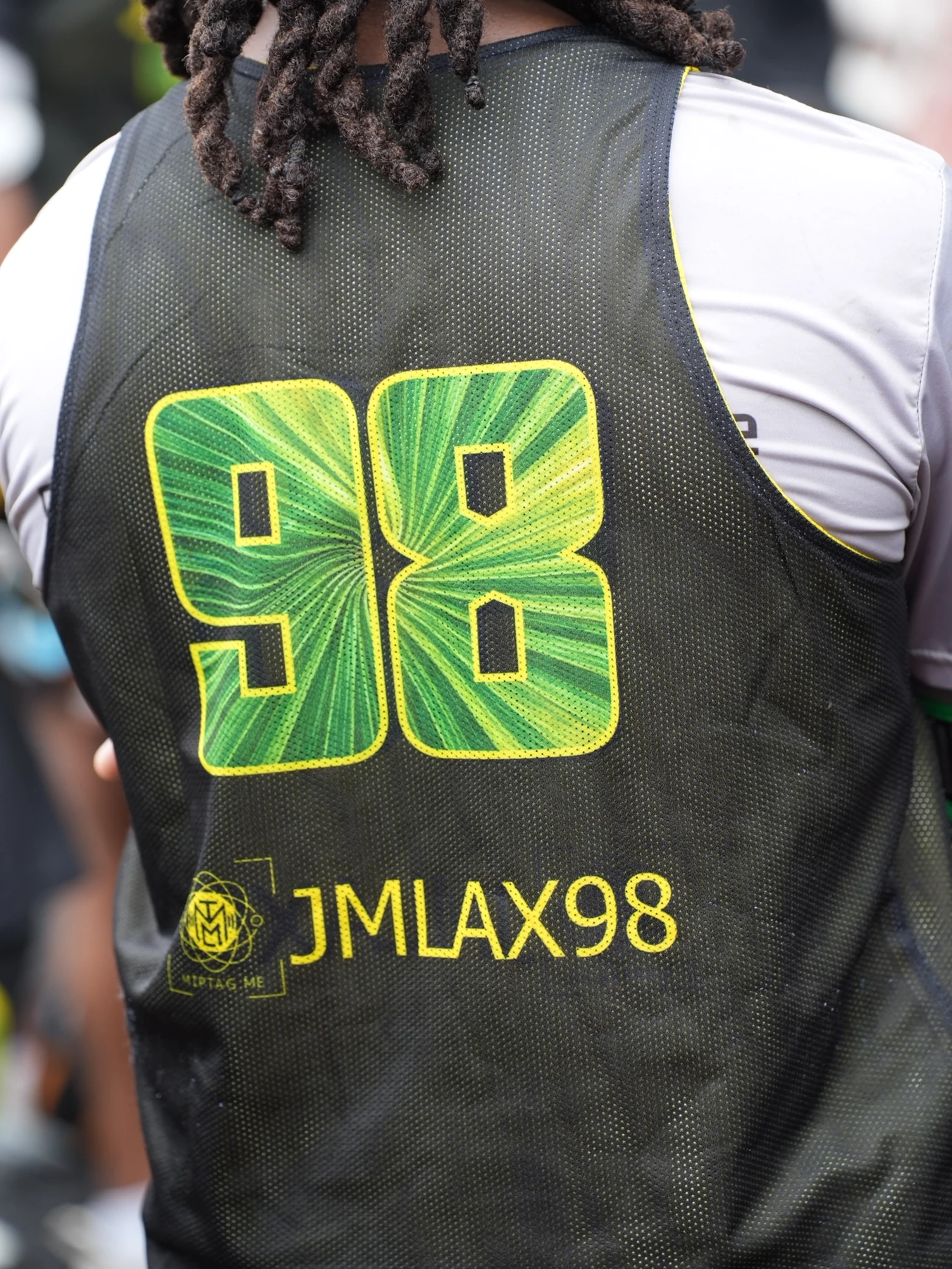 JMLAX98 printed beneath the number on a lacrosse jersey