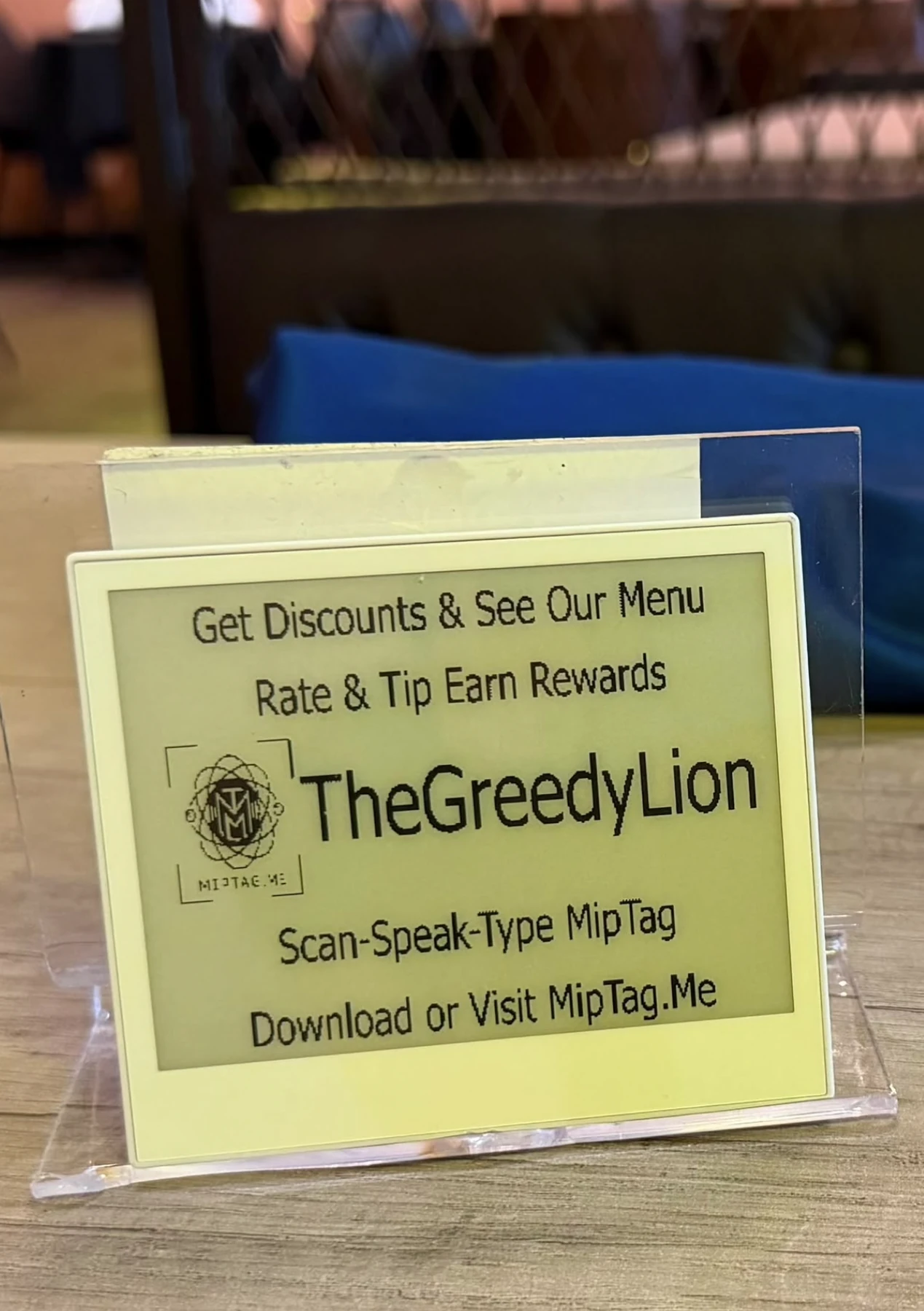 TheGreedyLion MipTag on a restaurant table stand